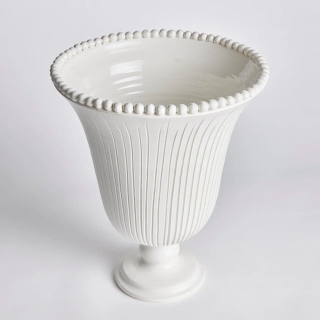 The Perla Wide Vase is handmade by Italian artisans in Tuscany, Italy. The graceful ribbing and hand-applied beading are...