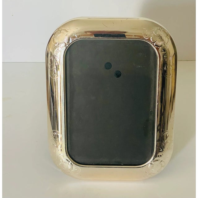 Lovely vintage silverplate photo frame, with rounded edges and incised details of decor.