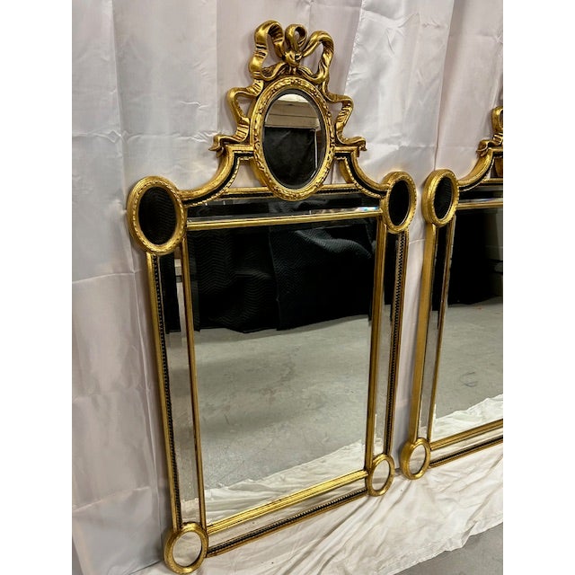 Elegant pair of Louis XVI style beveled mirrors by LaBarge. Nice size with a touch of added patina. Outer area framing...