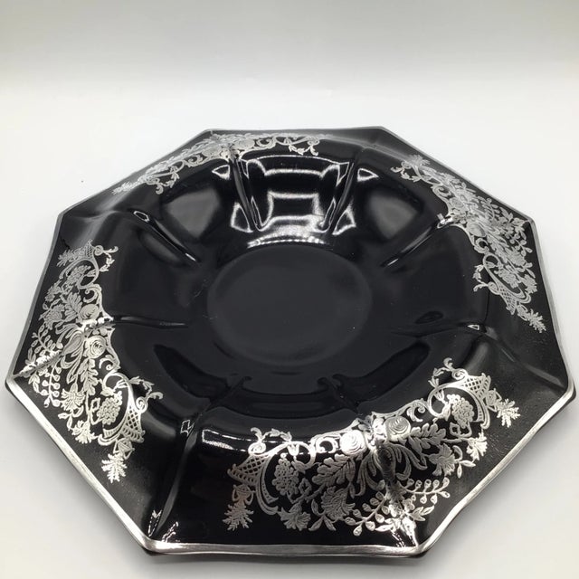 Here we have an octagonal Art Deco black amethyst footed glass bowl and matching candle holders with floral sterling...