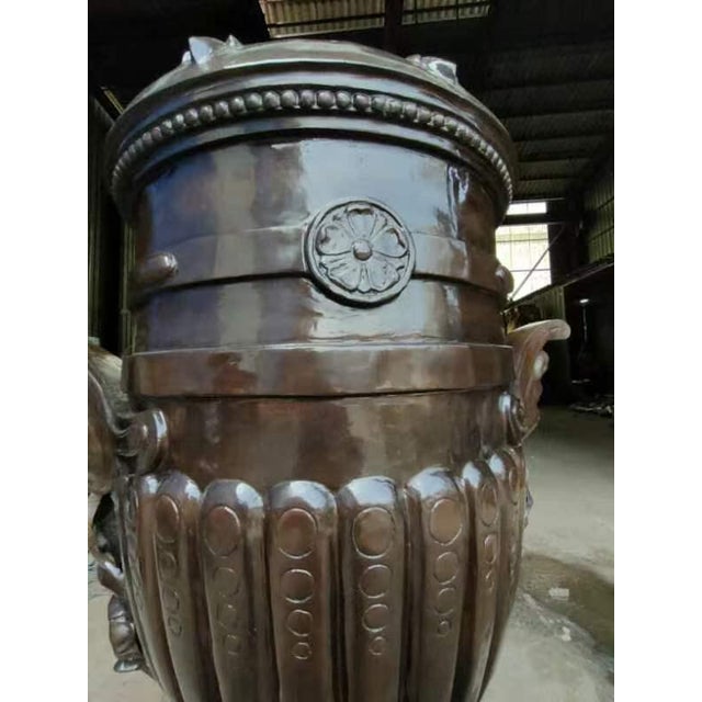 Pair of original, one-of-a-kind pure bronze Urns. Brand new. 68 inches high, 48 inches wide, 26 inch diameter bottom base....