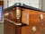 Gorgeous commode with two different types of mahogany. The brass/bronze trim is all original to the piece. The marble is...