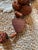 Listed is a vintage large 50-inch French rosary with carved corozo beads and a wooden cross. It is a religious item that...