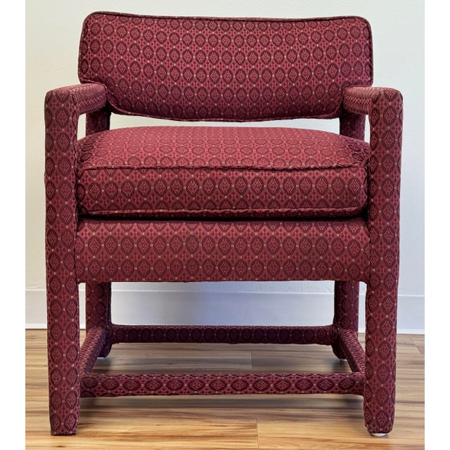 Vintage parsons style arm chair in a patterned two tone burgundy upholstery. Four legs supported by stretchers. Full...