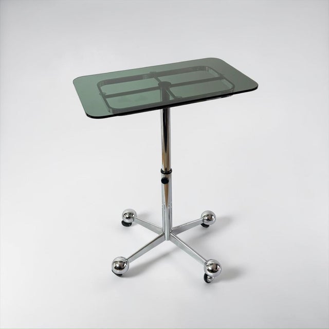 Adjustable chrome-plated steel table designed and manufactured by Allegri Parma in Italy during the 1970s. The piece...