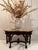 Impressive carved mahogany console table having figural forms and paw feet, topped off palatially with gorgeous curved...