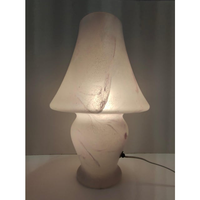 Made in Italy, 1970s. It is made in Murano glass with a pink marble effect. This lamp might show slight traces of use...