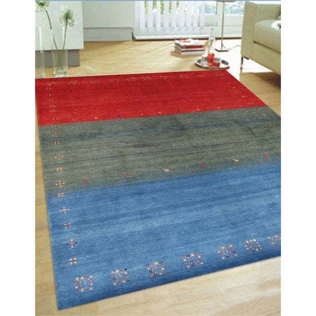 Gabbeh Hand-Knotted Area Rug is handmade with extra high pile and very simple, stylized designs. They are constructed from...