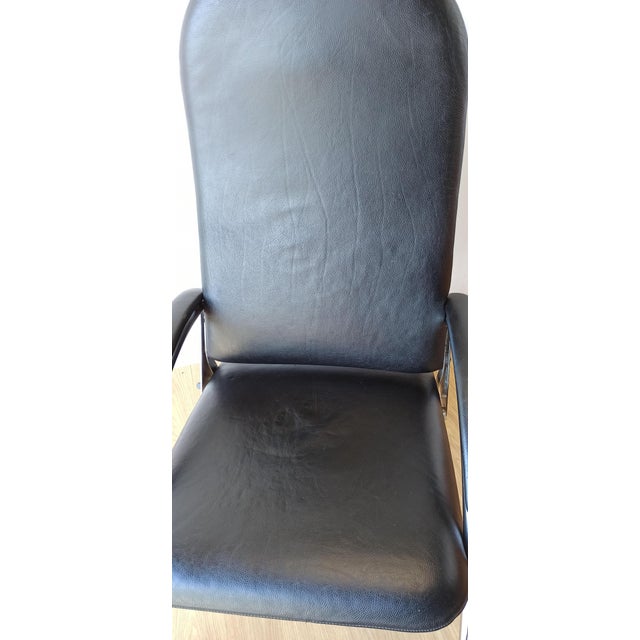 Chromed leather armchair and chaise longue from the 1970s. Original condition. Minor scratches, abrasions. The seat folds...