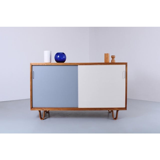 Nowadays hard to find, this original DB51 small birch wood sideboard. It was designed by Cees Braakman for Pastoe...