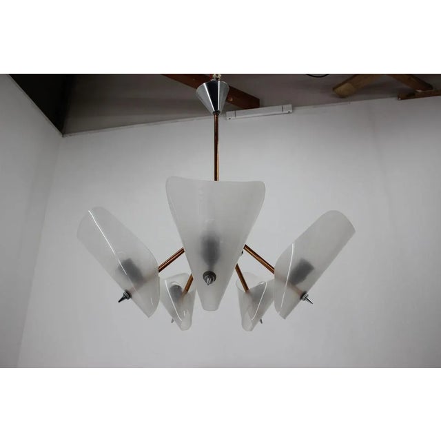 This beautiful chandelier was made in 1960s by drukov. It took part in a famous czech comedy ''pelisky''. Contains five...