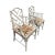 Silver painted vintage Hollywood Regency pair of Chippendale bamboo style arm chairs. The upholstery is newly recovered in...