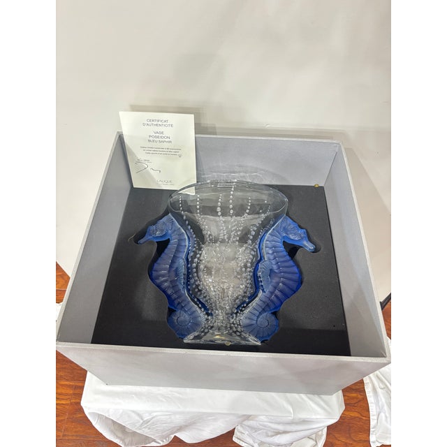 This magnificent Lalique Poseidon Vase is a limited‑edition creation, numbered 3 of 99. Handcrafted in clear and blue...