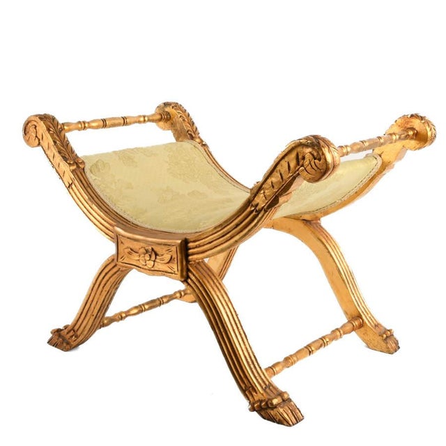 Elegant and decorative, this French-style giltwood vanity bench brings classical refinement to a dressing room, bedroom,...