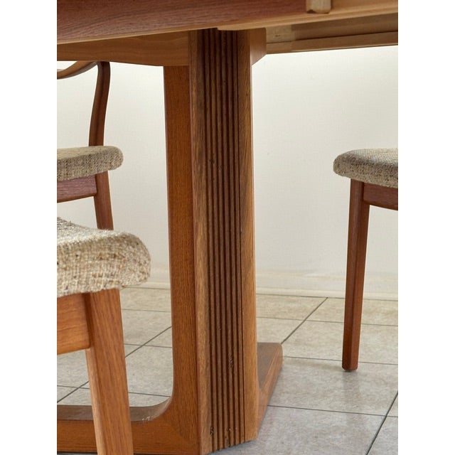 Boraam Rasmus Solid Teak Dining Room Table with two (2) expansion leafs and; six (6) matching padded upholstered chairs...