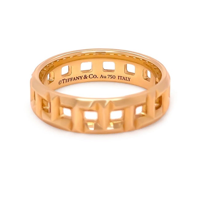 A modern and sculptural Tiffany & Co. T True wide ring crafted in 18ct yellow gold. Defined by the bold geometric “T”...
