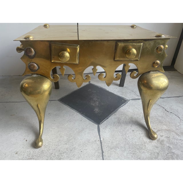 Crafted from solid, polished brass, this ornate piece features Queen Anne-style cabriole legs, pierced apron scrollwork,...