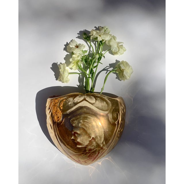 Art Nouveau Ceramic Wall Pocket This piece has a beautiful gilt exterior, with a lovely profile of a face on the front,...
