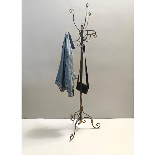 Made in Italy, 1960s. This revolving hat and coat rack is made in brass. It has a Meazza's stamp, which was a prestigious...