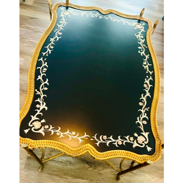 This elegant Regency-style cocktail table features a stunning scalloped serpentine tray top. The hand-painted Chinoiserie...