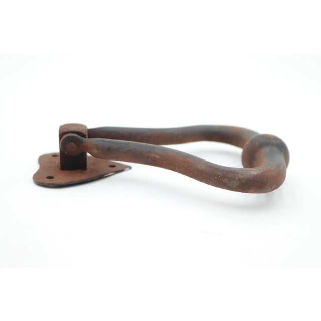 Traditional style cast iron door knocker with a black rusty finish. The original strike plate is not included. The...