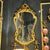 This elegant French Baroque style wall mirror features a richly detailed gold leaf frame with beautifully hand-carved...