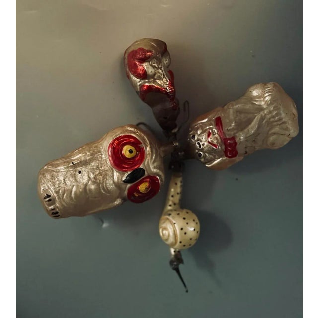 This charming set of four antique glass ornaments dates to the 1920s and features a delightful collection of animal...