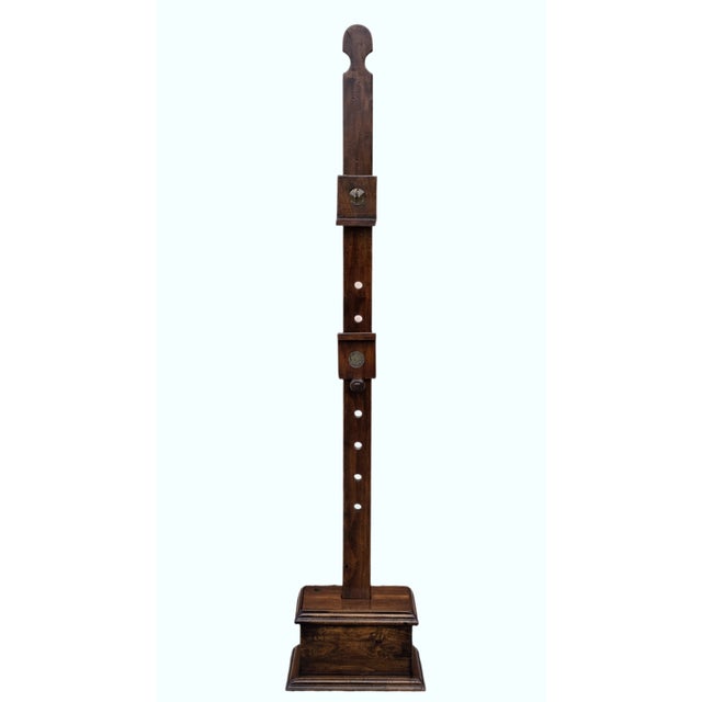 An elegant walnut display easel, dating back to the late 19th or early 20th century, featuring a simple, balanced design...