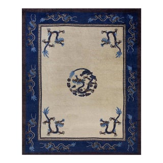 Traditional Dragon Design on a Beige Background With Navy Border Antique Chinese Peking Rug For Sale
