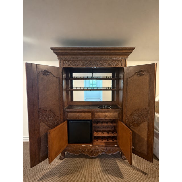 Monumental Carved Wood Home Bar Armoire With Mirrored Interior, Wine Storage & Mini Fridge For Sale - Image 14 of 14