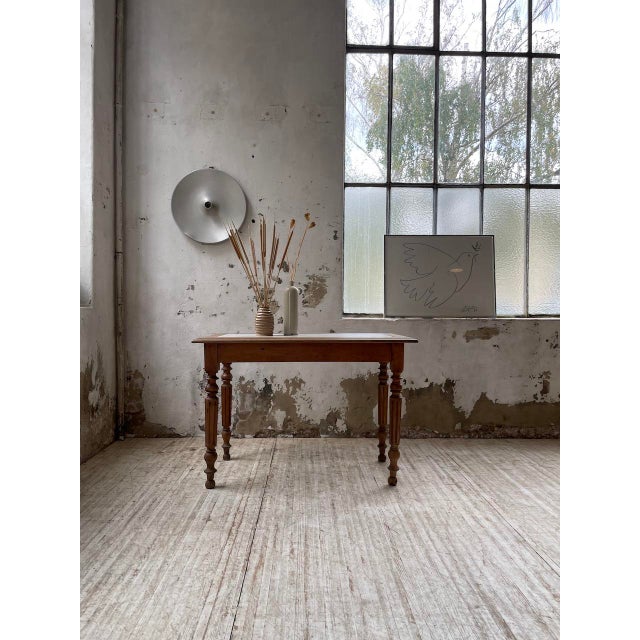 Walnut bistro table with walnut surround top and white marble interior. from the late 19th century, this table has a very...