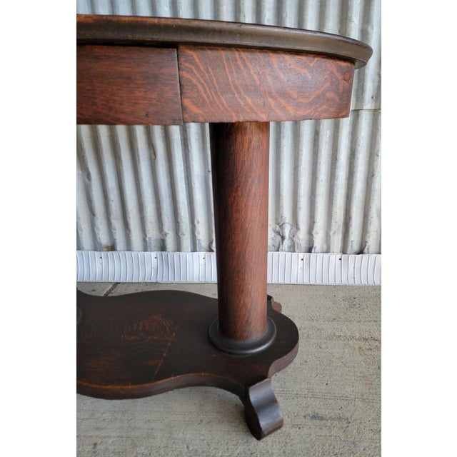 1910s Antique Oval Library Table Tiger Oak With Column Base Circa. 1890 For Sale - Image 5 of 13