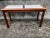 A suite of 3 Vintage Danish Mid-Century Teak Tables. Consisting of 2 side tables and a sofa or console table. Each table...