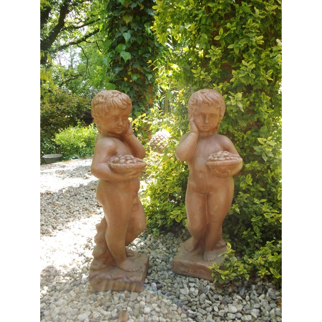 A pair of cherubs from the Impruneta region, renowned for its high-quality terracotta. Dimensions: approx. 67 cm high,...