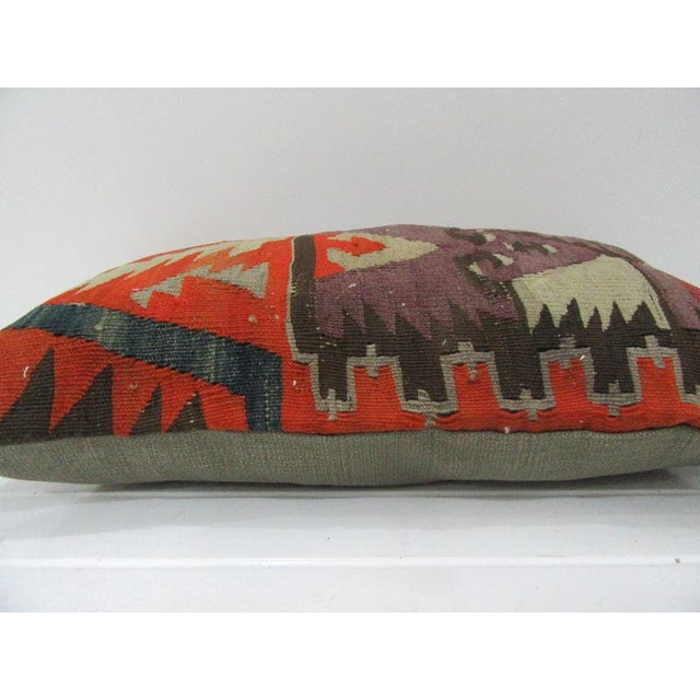 This is a pillow cover made from a vintage kilim rug. The piece was properly washed and ready to use. Pillow inserts not...