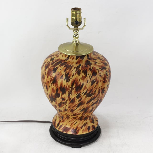 This striking pair of vintage table lamps features a classic ginger jar silhouette meticulously hand-painted with a...
