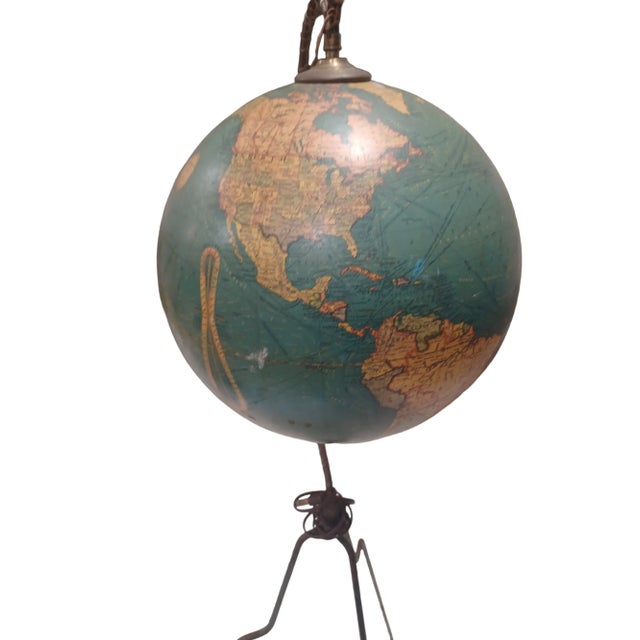 Vintage midcentury light up globe on tripod, Making for a unique floor lamp.