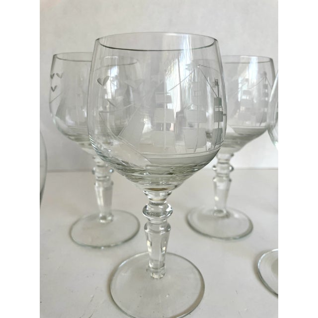 Here is a charming set of five glasses with matching decanter featuring an amazing etched, frosted schooner ship design!...