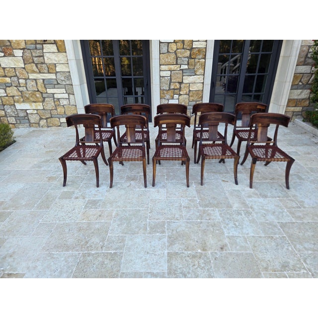 Solid walnut chairs. Modern Klismos dining chairs with upholstered seats cushions. The Robsjohn Gibbings style Klismos...