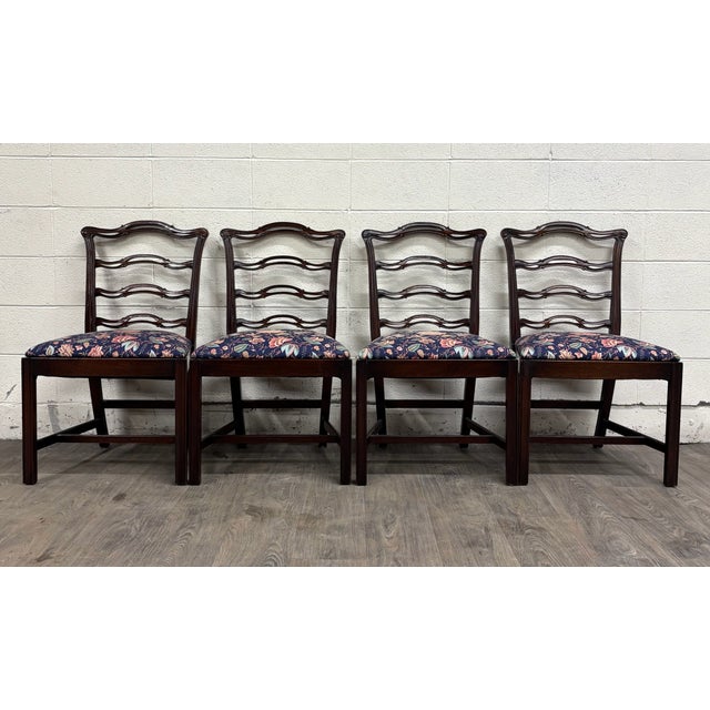 This is a gorgeous vintage set of four Chippendale style ladder back or ribbon back dining chairs. They feature ladder...