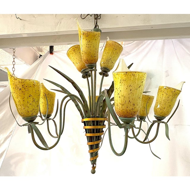Pretty vintage nine light chandelier by EuroFase Lighting. The shades are made of art glass to look like cala lilies. The...
