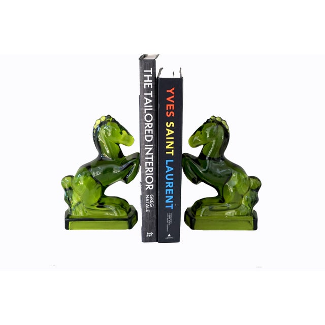Set of Art Deco green glass towering horse bookends, circa 1930s. Rare and stylish pieces. Come in a pair of two.