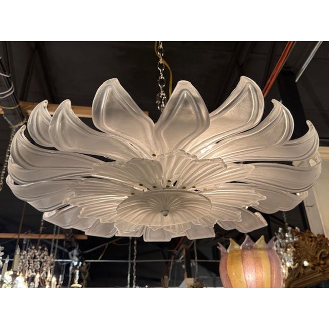 The Modern Frosted Murano Glass Flush Mount Chandelier is a stylish and elegant lighting fixture perfect for adding a...