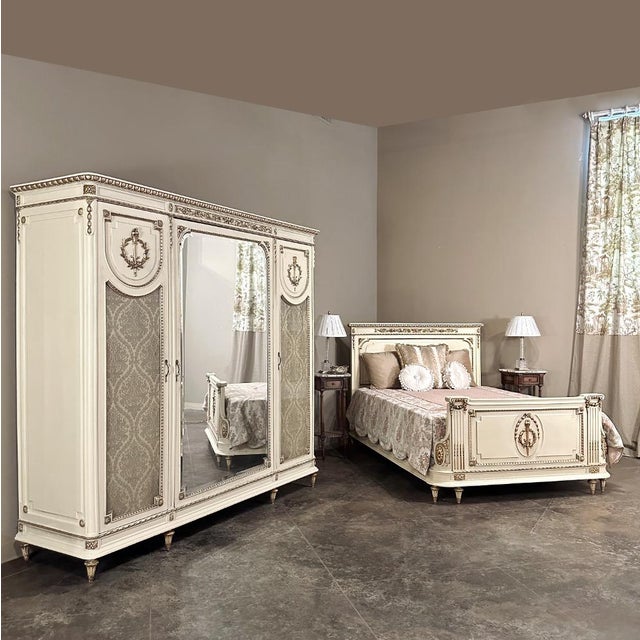 Antique Italian Neoclassical Painted Triple Armoire is a splendid expression of the classical style that dates back three...