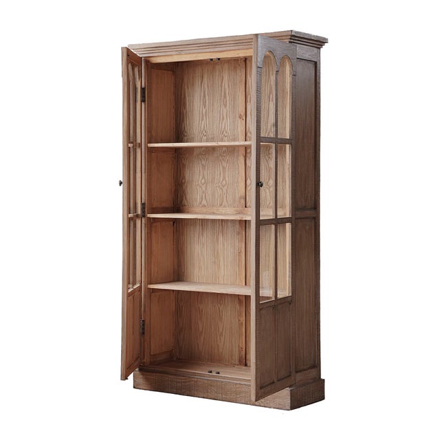 Crafted from reclaimed pine with a beautifully aged finish, this tall display cabinet brings European character with...