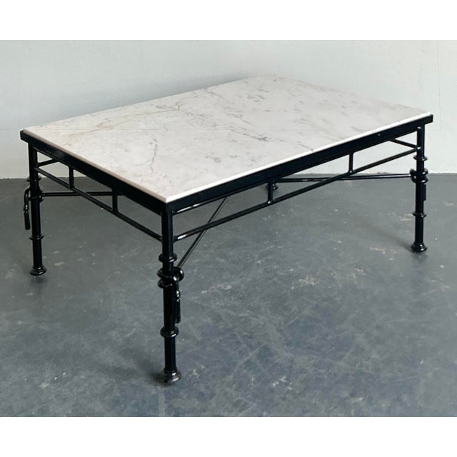 Define your living space with the timeless sophistication of this vintage Hollywood Regency style coffee table. The piece...