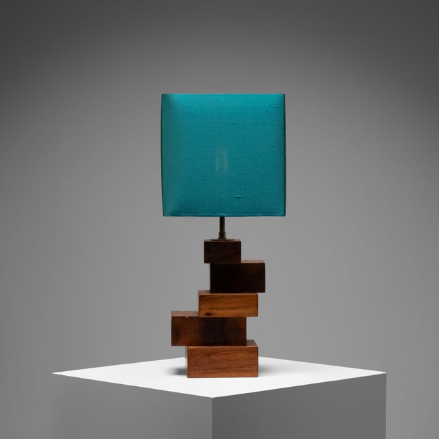 This sculptural table lamp exemplifies the architectural approach to form that characterized much of French decorative...