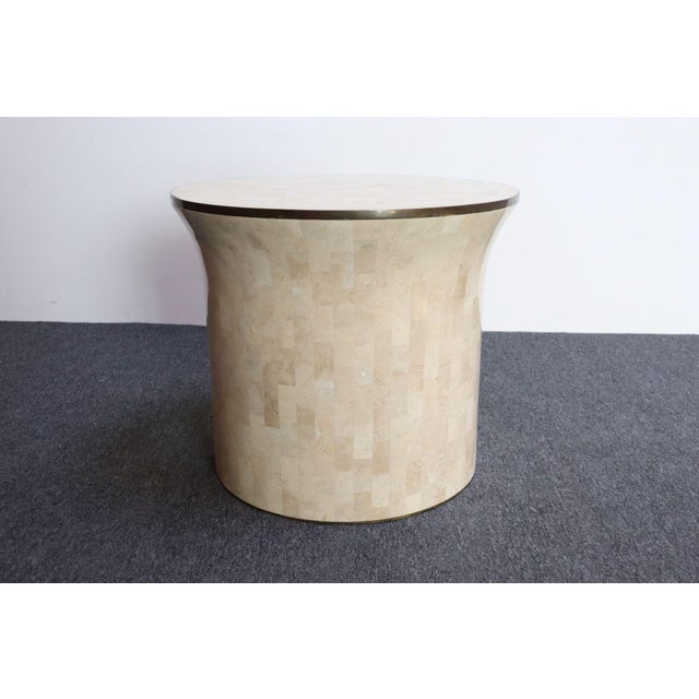 Attractive accent/side table in beige tessellated fossil stone with brass inlay border by Maitland-Smith (ca. 1970s,...