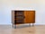 1950s sideboard from the Isa company of Bergamo, teak wood, two sliding doors, lacquered metal handles. This piece has an...