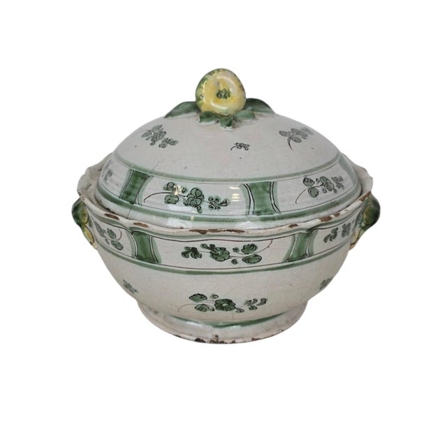 A covered majolica tureen from the Cerreto / Naples region, dating to around 1780. The rounded body is raised on a short...